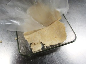 and position the other layer over your dish, gently peel off the remaining wax paper.